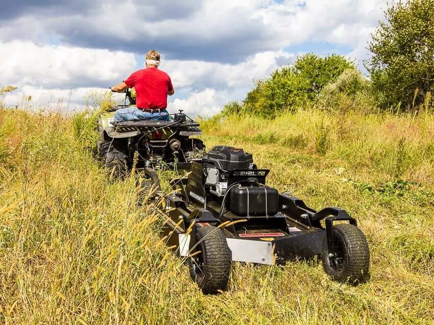 Swisher 44 Commercial Pro Rough Cut Mower, black, with rear wheels and Kawasaki engine.