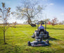Swisher 44 Finish Cut Mower, black and gray, rear view with large wheels and mower deck.