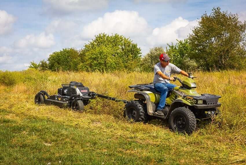 Swisher 44 Commercial Pro Rough Cut Mower, black, angled view with robust wheels and frame.