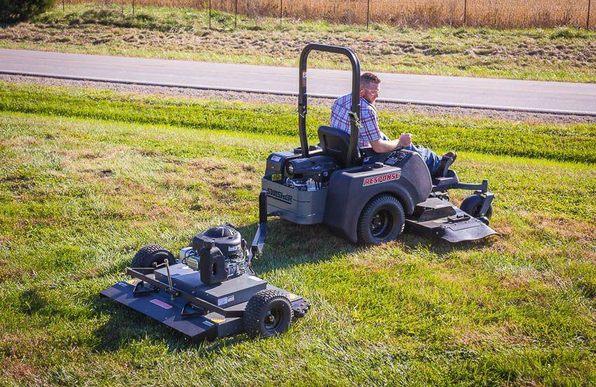 Swisher 44 Trail Mower 11.5 HP, angled view, featuring black body and durable wheels.