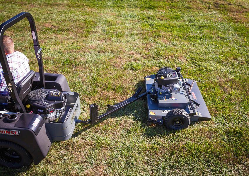 Swisher 44 Trail Mower 11.5 HP, angled view with handlebars, engine, and rear wheels.