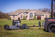 Swisher 44 Trail Mower with 11.5 HP engine, gray with large rear wheels and tow attachment.