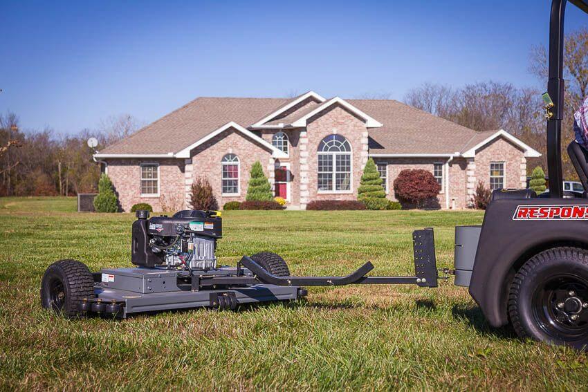 Swisher 44 Trail Mower with 11.5 HP engine, gray with large rear wheels and tow attachment.