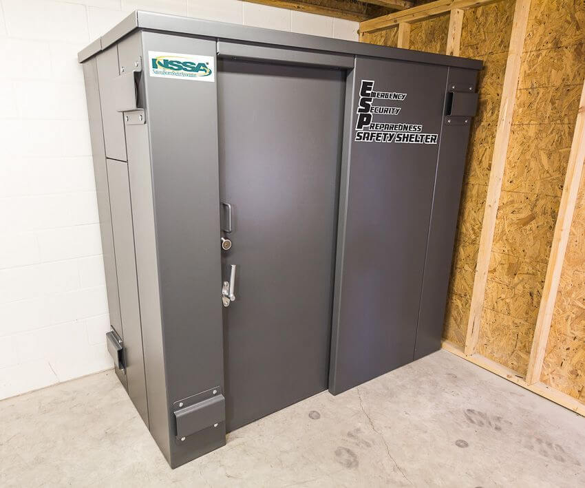 Swisher 6 Person ESP Safety Shelter front view, gray exterior with secure locking door and sturdy design.