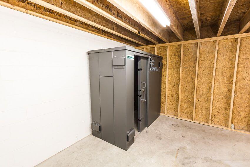 Swisher 6 Person ESP Safety Shelter, gray, front view with secure doors and sturdy construction.