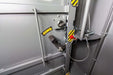 Swisher 6 Person ESP Safety Shelter interior door latch, grey with safety labels and locking mechanism.