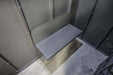 Swisher 6 Person ESP Safety Shelter interior view, featuring a gray bench and sturdy walls.