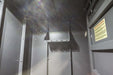 Swisher 6 Person ESP Safety Shelter interior view, gray metal with mounting brackets and ventilation.