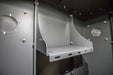 Swisher 6 Person ESP Safety Shelter internal view with gray metal shelves and ventilation openings.
