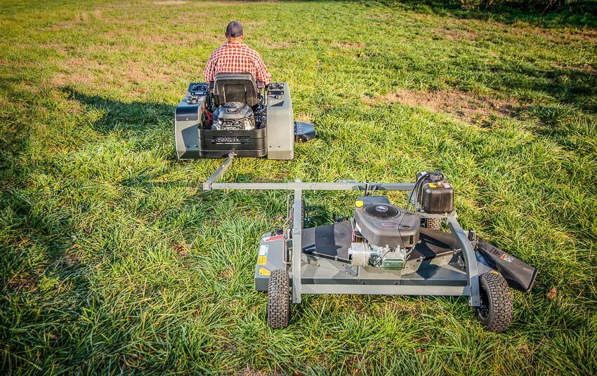 Swisher 60" Trail Mower 12V with engine, rear view showcasing dual tires and mower deck.
