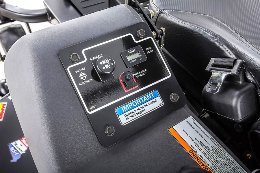 Swisher 60" Zero Turn Mower control panel, featuring buttons, hour meter, and safety warnings.