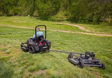 Swisher 66 Commercial Mower 14.5HP Kawasaki, black, rear view with trailer attachment and wheels.