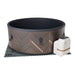 mSpa Round Hot Tub with patterned exterior and white pump, angled view for better visibility.