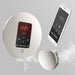 Mr. Steam Control Panel and smartphone app, sleek silver design with digital display and controls.