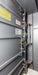 Swisher 9 Person ESP Safety Shelter interior view, featuring gray walls and safety harness attachments.