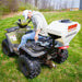 Swisher Commercial Pro ATV Spreader, white hopper on ATV, angled view, designed for efficient spreading.