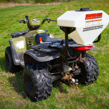 Swisher Commercial Pro ATV Spreader, white hopper with a rear view mounted on an ATV.