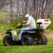 Swisher Commercial Pro ATV Spreader on ATV, white and red hopper, angled view.