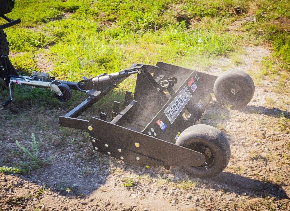 Swisher Commercial Pro RoadBuster Driveway Grader, adjustable black metal with large wheels, angled view.