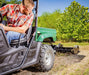 Swisher Commercial Pro RoadBuster Driveway Grader, angled view, black attachment with wheels.