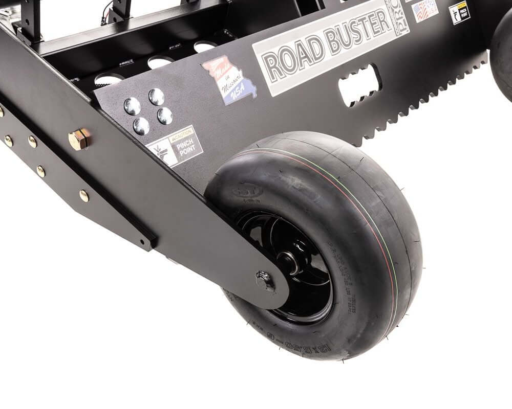Swisher Commercial Pro RoadBuster Driveway Grader angled view featuring black tires and sharp blade edge.
