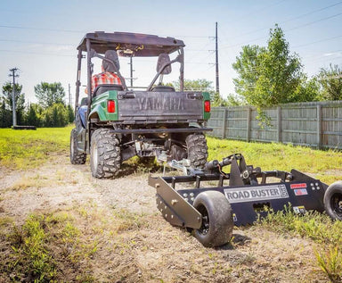 Swisher Commercial Pro RoadBuster Driveway Grader, black with large wheels and adjustable hitch.