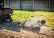 Swisher Commercial Pro RoadBuster Driveway Grader, black with wheels and mounted to an ATV.