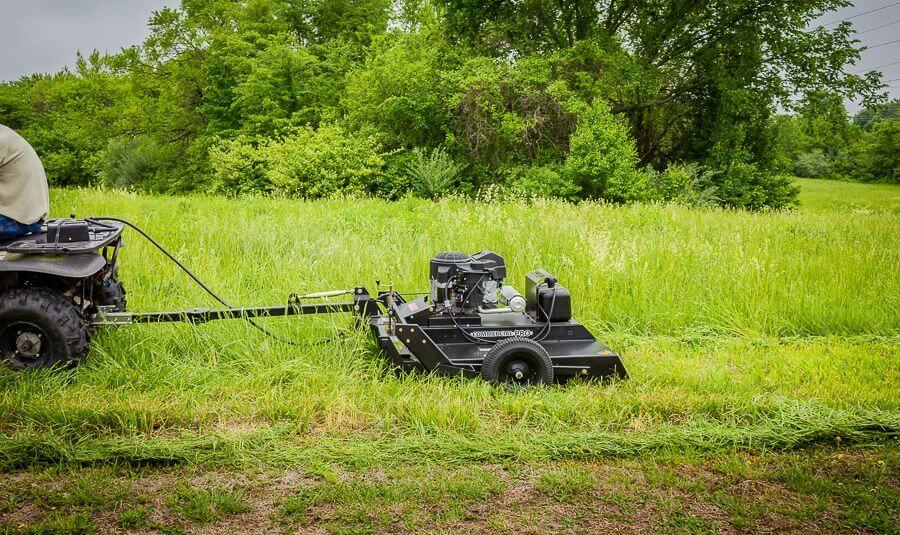 Swisher Country Cut 44" Rough Cut Mower, black with wheels and Kawasaki engine, angled view.