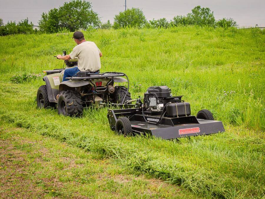 Swisher Country Cut 44" Rough Cut Mower, angled view, black with powerful Kawasaki engine and wheels.