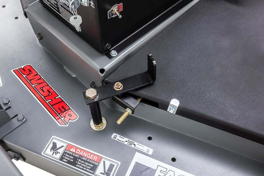 Swisher Fast Finish 60 mower detail view, featuring black components and adjustment lever.
