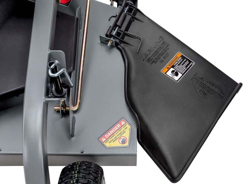 Swisher Fast Finish 60-inch mower side view, featuring a black discharge chute and warning labels.