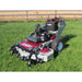 Shepherd Walk-Behind Lawn Mower, angled view, featuring a red and silver design with large wheels.
