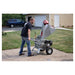 Dosko brush chipper operator feeding long branch