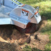 Dosko 337 stump grinder cutter head grinding into a tree stump front close-up