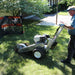 Dosko 337 walk-behind stump grinder operator side view in yard