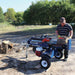 Iron & Oak BHVH2418GX tow-behind splitter in field use