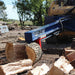 Iron & Oak SMH2419 skid steer log splitter splitting log in use