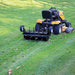 Maxim 36 in. plug aerator rear in-use view behind mower
