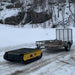 Movex XC-48 remote-controlled carrier towing trailer in snow
