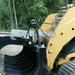 Storm Attachments Hose Protector Kit routing hydraulic hoses on machine